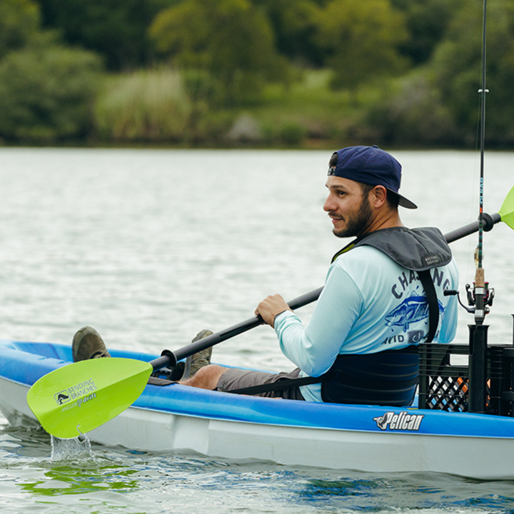 angler drift snap button electric green being paddled in Pelican blue boat