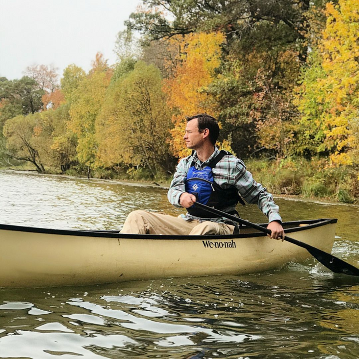 Man paddling from the stern with the Black Pearl 11