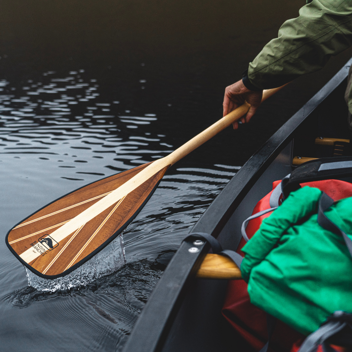 Java ST wooden canoe paddle coming up out of the water during the recovery stroke