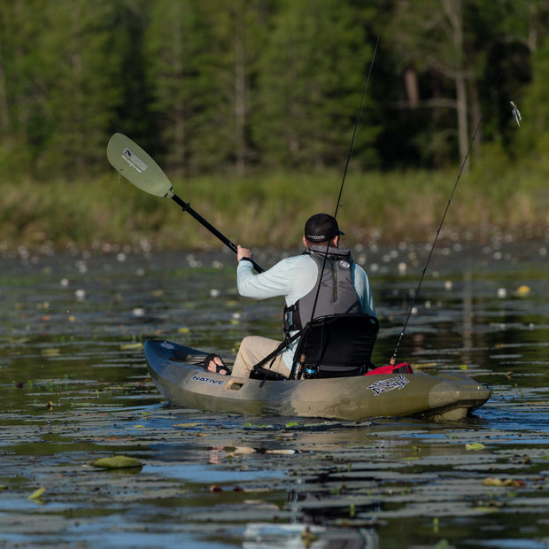 Kayak angler paddling away from camera 