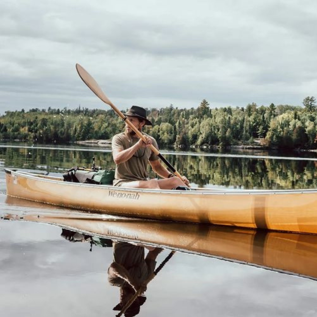 Impression Solo all wood solo canoe or kayak paddle in a Wenonah canoe