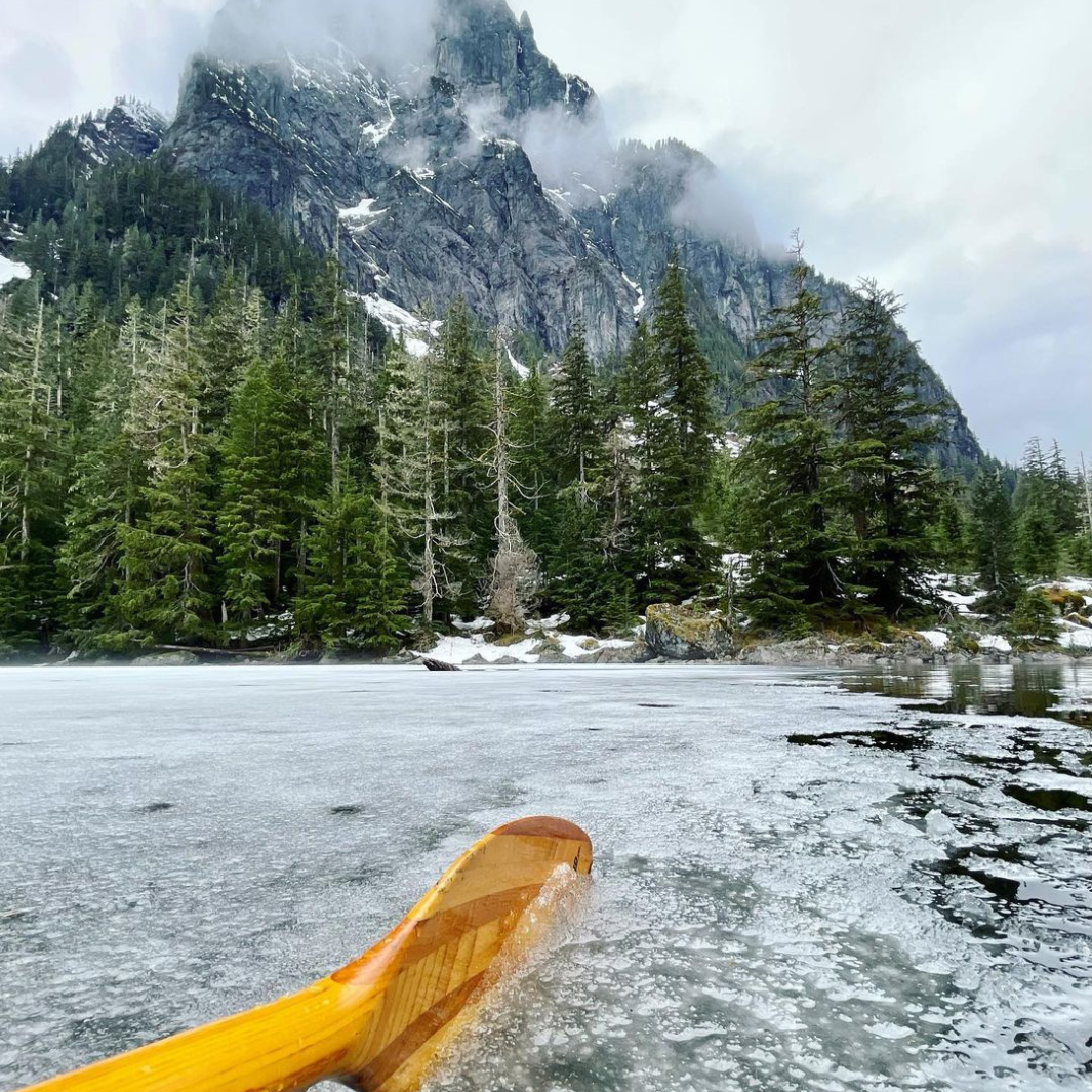 Impression Solo blade in the ice covered waters with the mountain and fog in front
