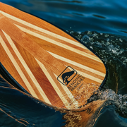 Sunburst canoe paddle in water